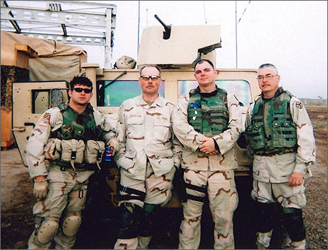 Joey Hunt in military uniform standing beside other soldiers in uniform Joey Hunt in military uniform standing beside other soldiers in uniform